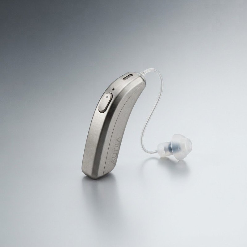 Sleek silver receiver-in-canal hearing aid